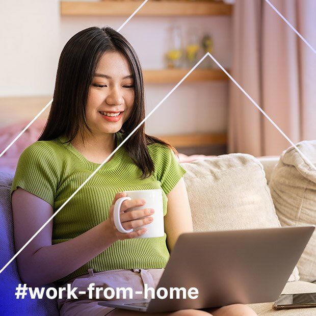 Workfromhome Interactive discussion between CloseAbility team members in modern office setting with laptops and documents, featuring white geometric overlay design.